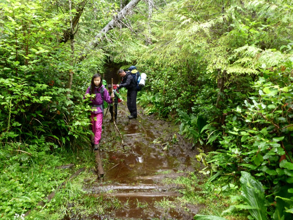Balance and teamwork to cross the mud river