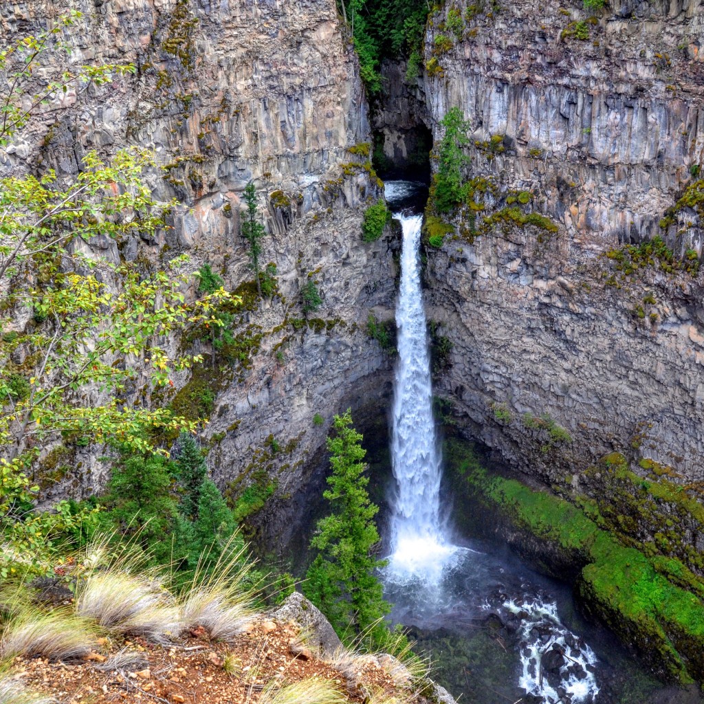 Spahats Creek Falls, also called Spahats Falls, is a waterfall on Spahats Creek within Wells Gray Provincial Park of British Columbia, Canada. Common references place the falls at around 60 m (197 ft) tall, but taking into account the second tier, it is closer to 75–80 meters tall. Spahats Creek rises from snowmelt and springs at a pass between Raft Mountain and Trophy Mountain. It flows 15 km west before tumbling over Spahats Falls and entering the Clearwater River. Spahats is the First Nations term for bear and the stream was long known as Bear Creek. When the first accurate topographical map of the Clearwater Valley was published in 1953, it labelled the stream as “Bear Creek” and the falls as “Spahats (Bear) Creek Falls”. By the late 1960s, “Spahats” had become an accepted alternative due to the large number of Bear creeks in British Columbia and was officially adopted.[4] Spahats Falls owes its formation to deposits of volcanic rock in the Wells Gray-Clearwater volcanic field. Starting about 300,000 years ago, numerous eruptions from Trophy Mountain poured into the Clearwater River Valley and filled it layer upon layer to a depth of over 300 m (980 ft).